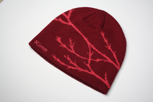 Burgundy beanie fallen branch